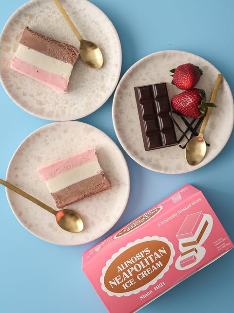 Neapolitan slices and chocolate on a blue table